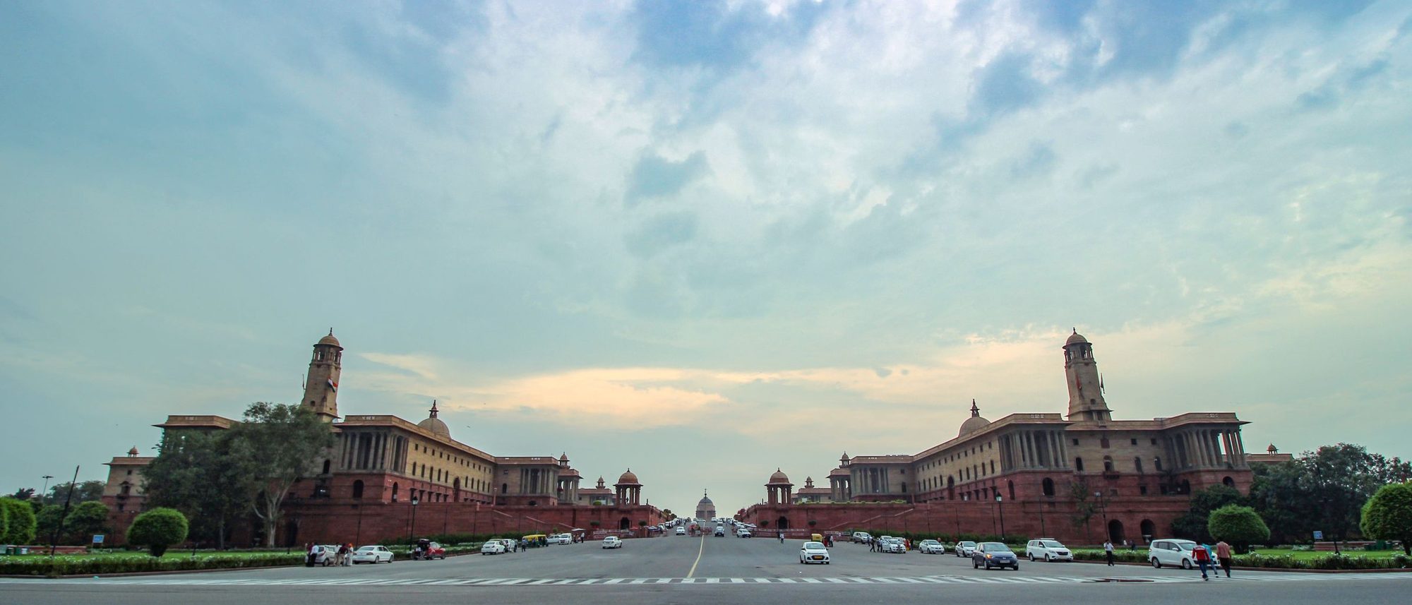 A panorama of the Secretariat Buildings in New Delhi under a clear sky.