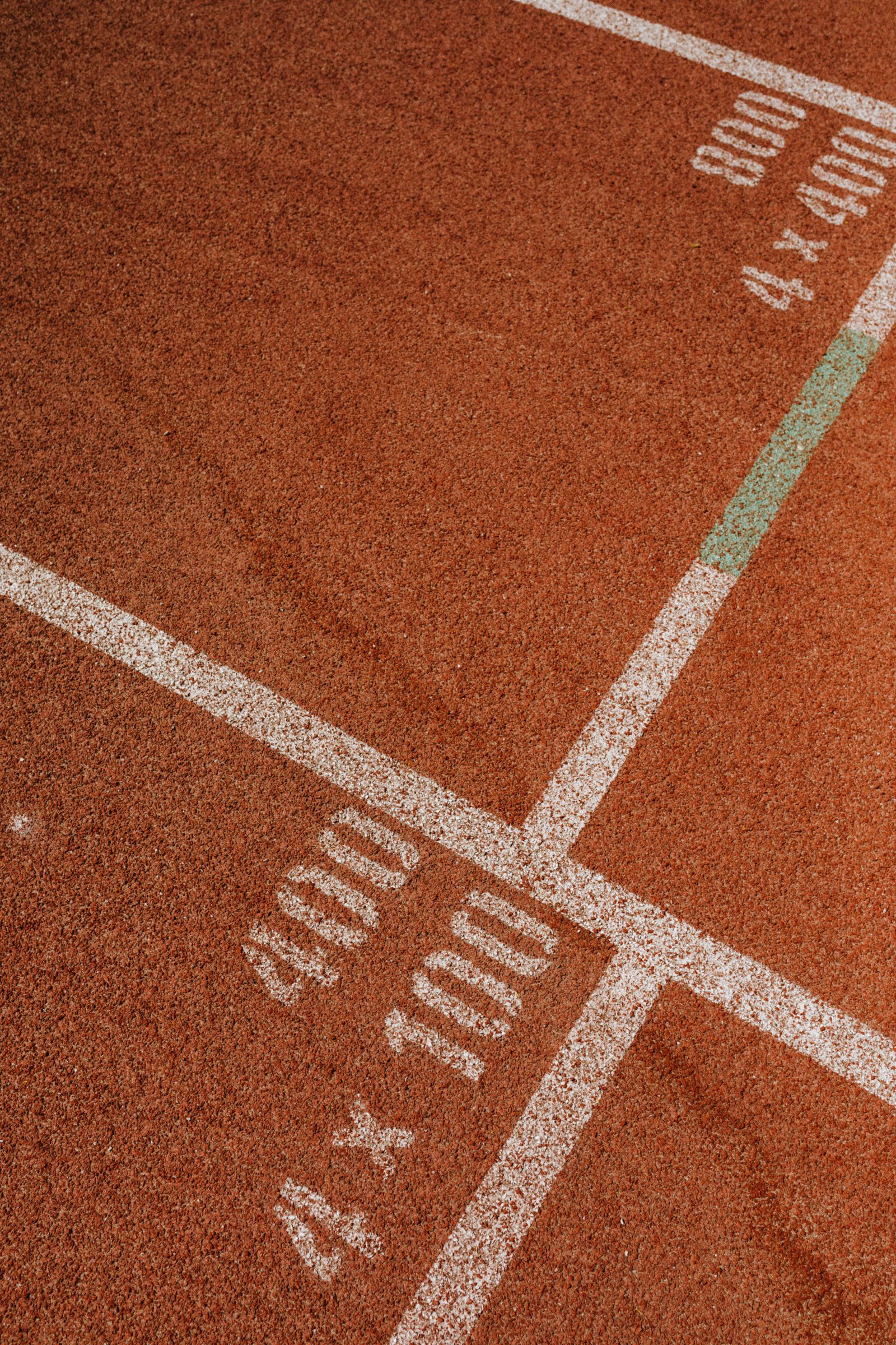 Start markings painted across the lanes of an athletics track.
