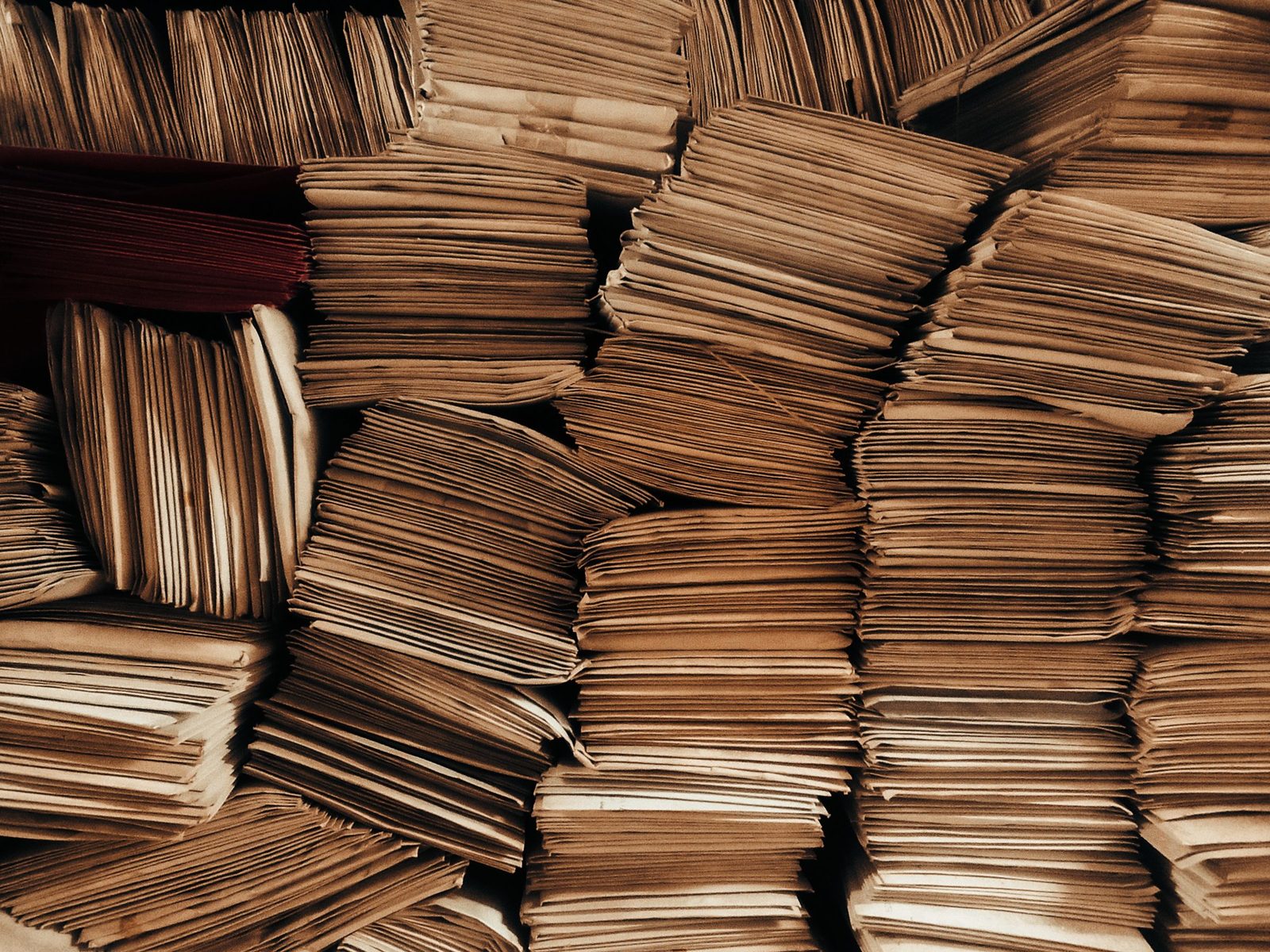 Brown envelopes stacked in neat rows.