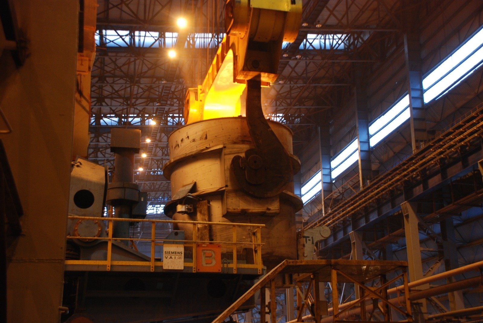 A ladle and converter under bright lights in the steel melting shop of the IISCO steel plant