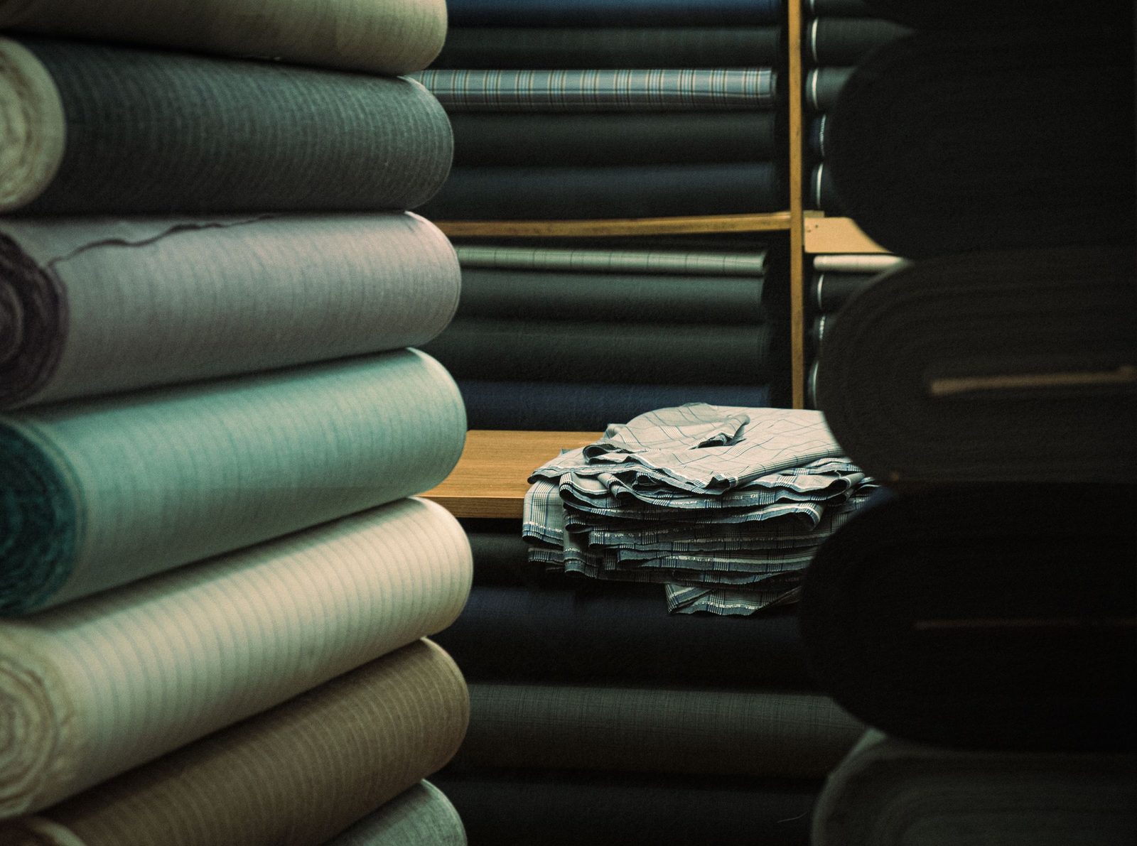 Rolls of textile in many colours and patterns on display in a warehouse in Istanbul.