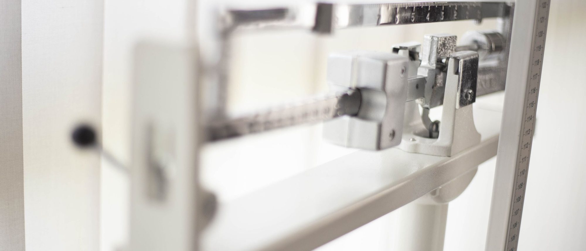 A classic mechanical balance scale seen close up.