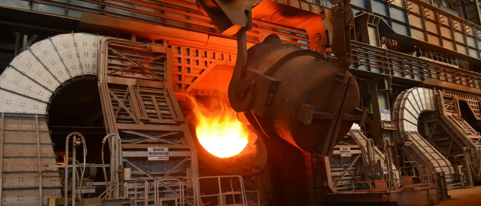 Molten metal glowing orange at a converter inside the IISCO steel plant in Burnpur